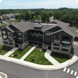 Aerial view of apartments complex, showcasing the beautiful landscape and modern architecture